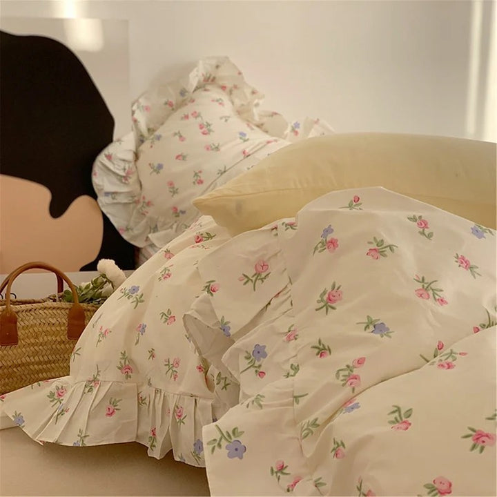 VibeCore Blossom French Ruffles Duvet Cover Set close-up, left front view highlighting soft cotton fabric, intricate French ruffles, and elegant floral accents.