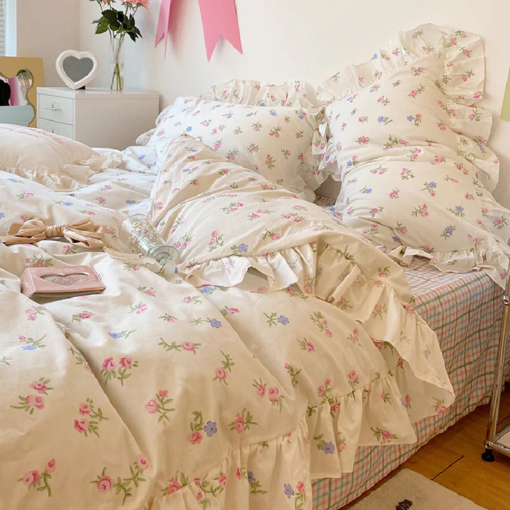 VibeCore Blossom French Ruffles Duvet Cover Set close-up, side view with the cover pulled back, showcasing the delicate ruffle design and soft cotton texture.