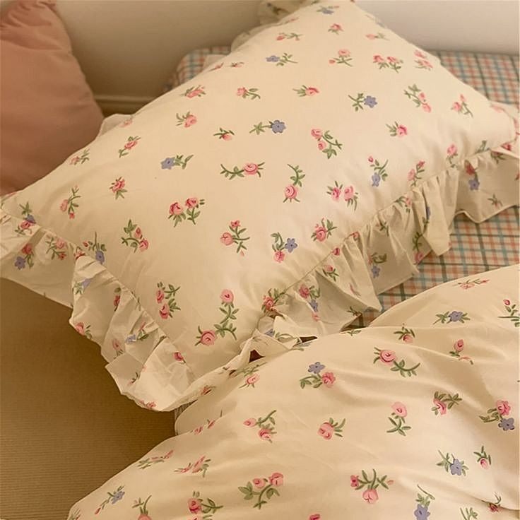 VibeCore Blossom French Ruffles Duvet Cover Set close-up, top view of pillowcase showcasing delicate French ruffles and soft cotton texture.