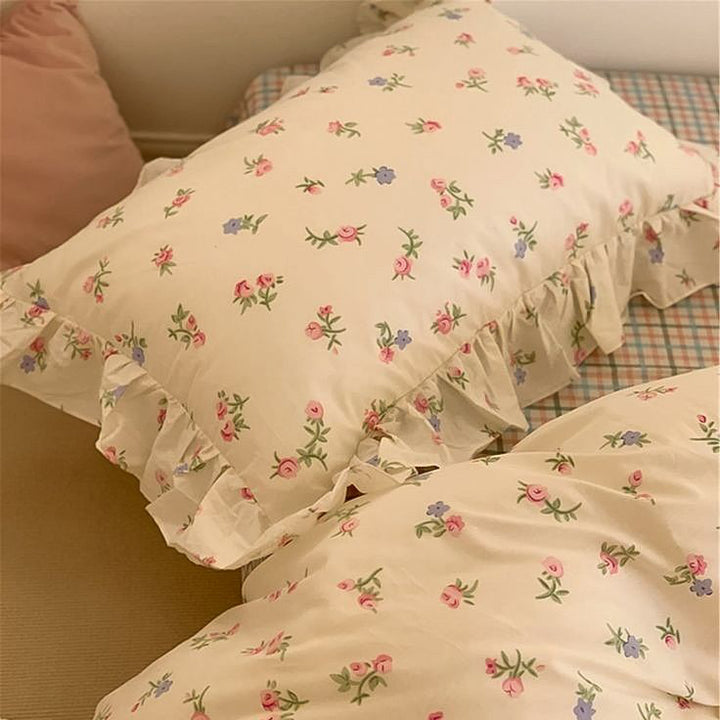 VibeCore Blossom French Ruffles Duvet Cover Set close-up, top view of pillowcase showcasing delicate French ruffles and soft cotton texture.