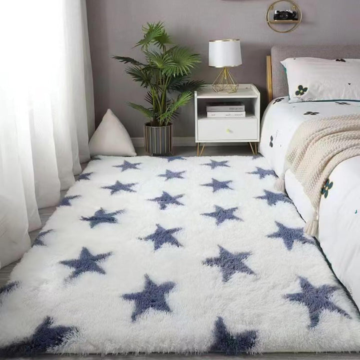 VibeCore Blue & White Stars Area Rug featuring a dreamy starry design, adding a cool celestial vibe to any room. Soft polyester fiber texture with a non-slip backing for safety. Perfect for the living room, bedroom, or dorm. Easy to clean and maintain.