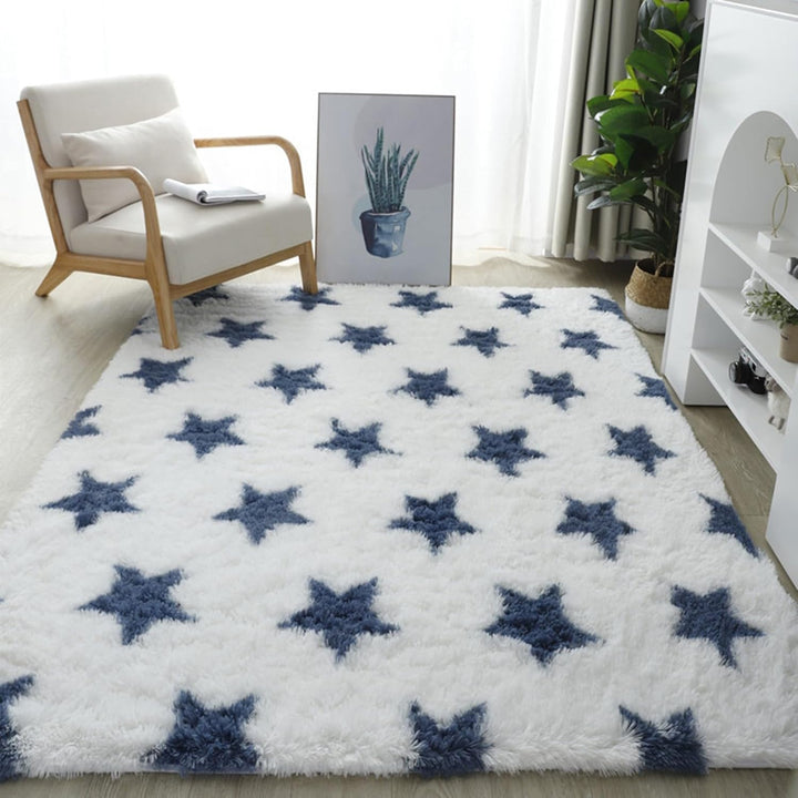 VibeCore Blue & White Stars Area Rug on floor with starry design, soft texture, and non-slip backing. Adds a celestial touch to any room while providing comfort and safety.