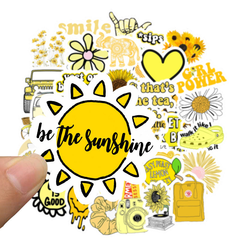 VibeCore Bright Yellow Sticker close-up of 'Be the Sunshine' design, featuring a trendy, uplifting phrase with a vibrant sun. Perfect for laptops, phones, and accessories.