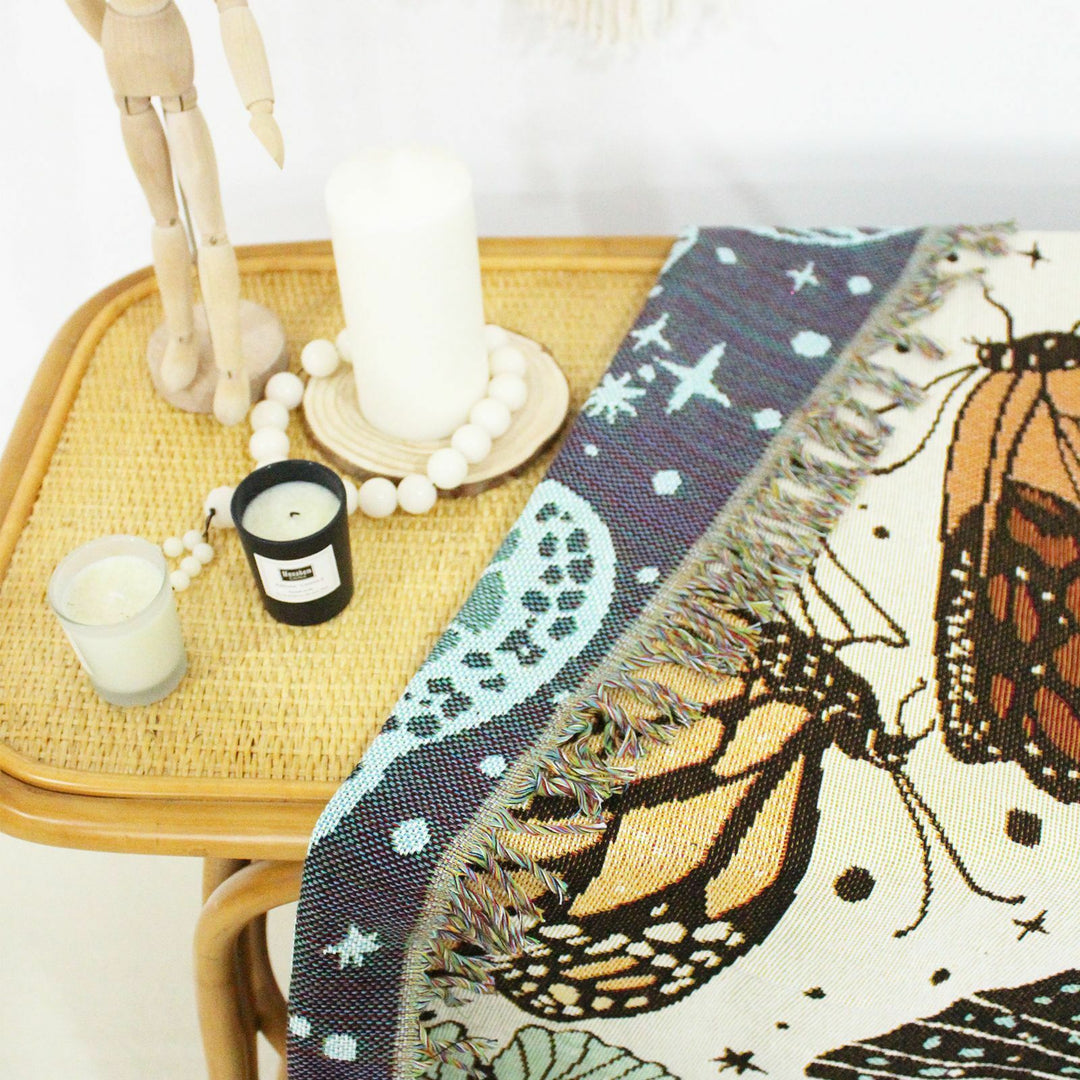 VibeCore Butterflies Woven Blanket reversible design close-up, highlighting vibrant butterfly patterns and soft 100% combed cotton texture.