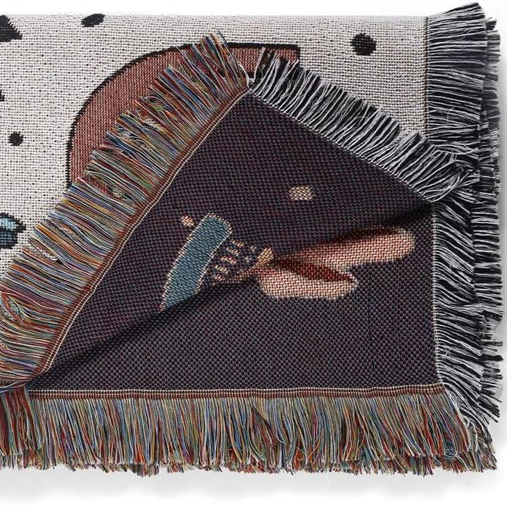 VibeCore Cactus & Crystals Woven Blanket neatly folded, displaying its earthy cactus and crystal design with soft, reversible cotton texture.