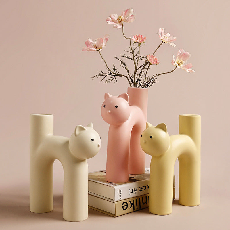VibeCore Cat Ceramic Vase in three colors—beige, yellow, and light pink—displayed together, showcasing their playful cat-shaped design.