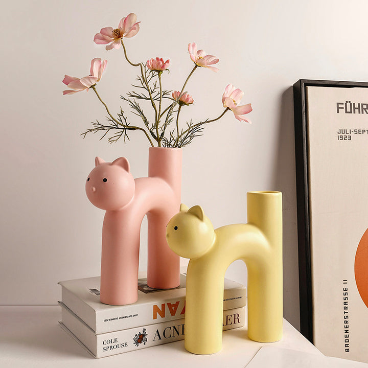 VibeCore Cat Ceramic Vase in yellow and light pink, highlighting their cute, playful cat-shaped design.