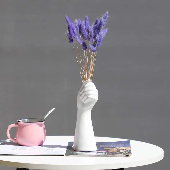 VibeCore Ceramic Hand Vase holding artificial flowers, sleek hand-shaped porcelain design, perfect for adding a touch of elegance and timeless beauty to your space.