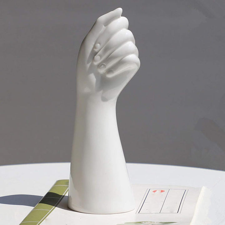 VibeCore Ceramic Hand Vase product view, showcasing elegant hand-shaped porcelain design, ideal for holding flowers or decorative items in a minimalist, stylish display.