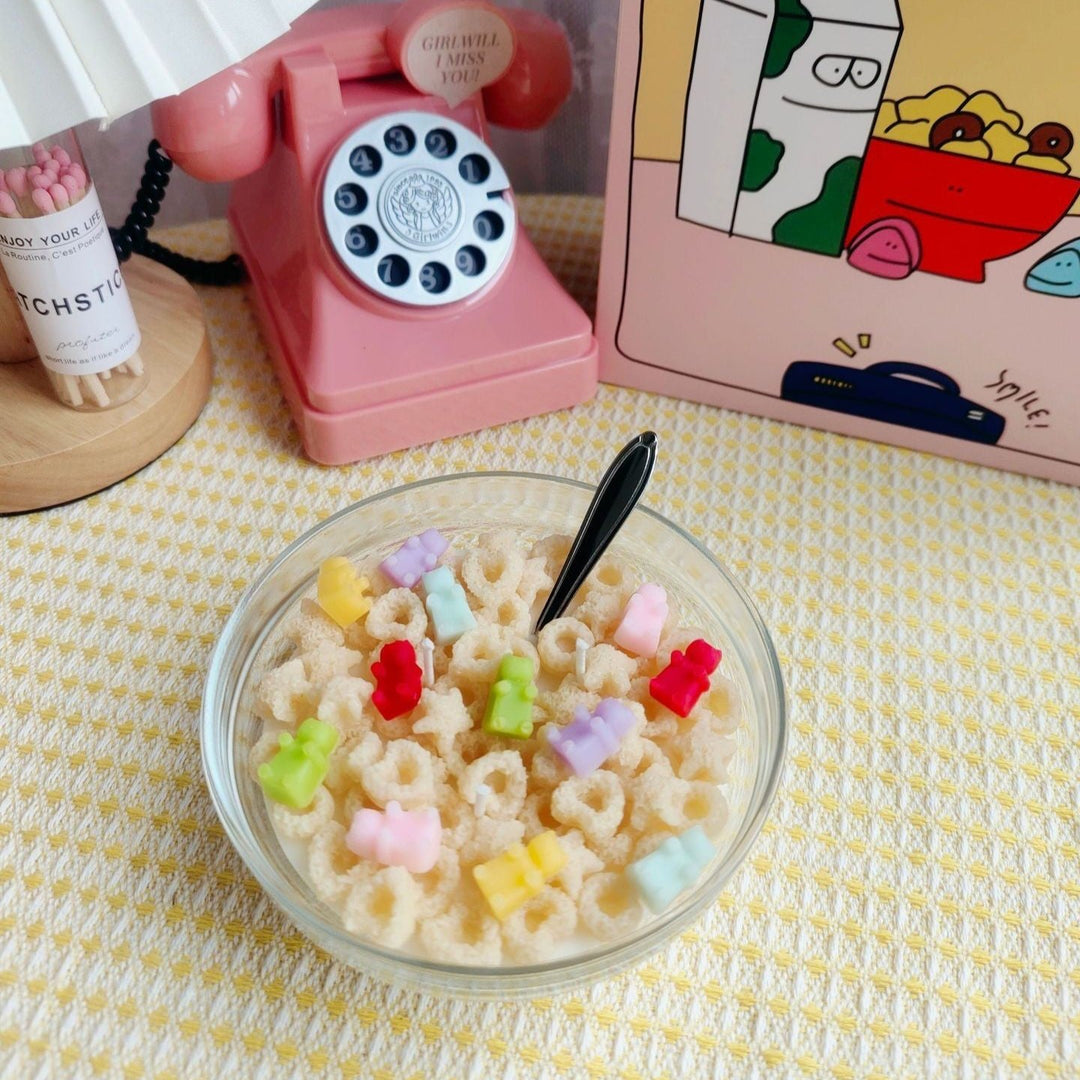 VibeCore Cereal Bowl Candle styled like Cheerios with gummy bears, featuring a realistic cereal design made from soy wax in a white bowl, adding playful charm to any room.