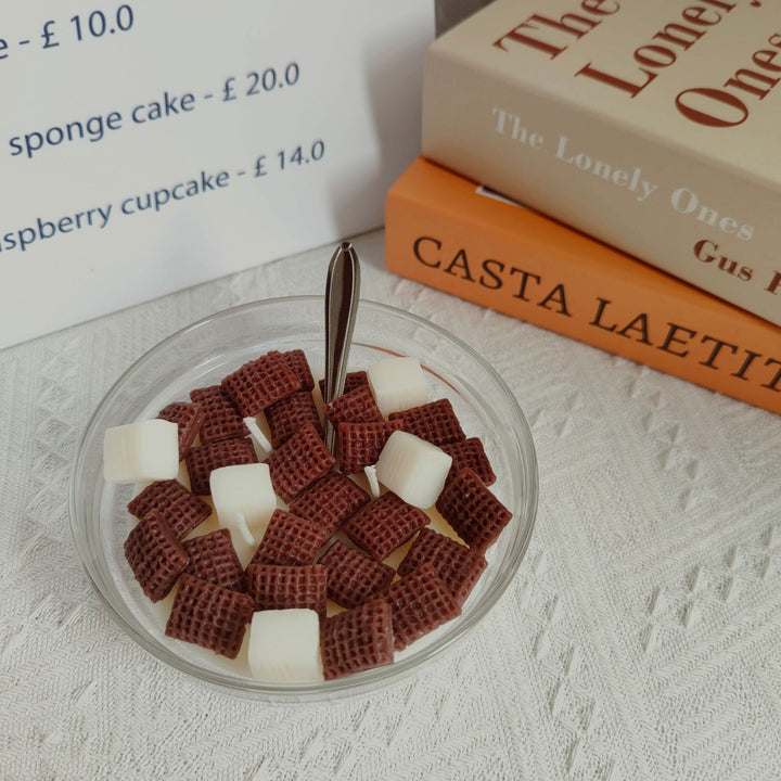 VibeCore Cereal Bowl Candle styled to look like Mini Wheats cereal, with textured wax pieces and a milky soy wax base in a realistic bowl design.