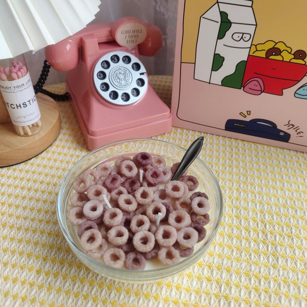 VibeCore Cereal Bowl Candle featuring wholewheat Cheerios-style soy wax pieces in a white bowl, realistic and aesthetic for playful room decor.
