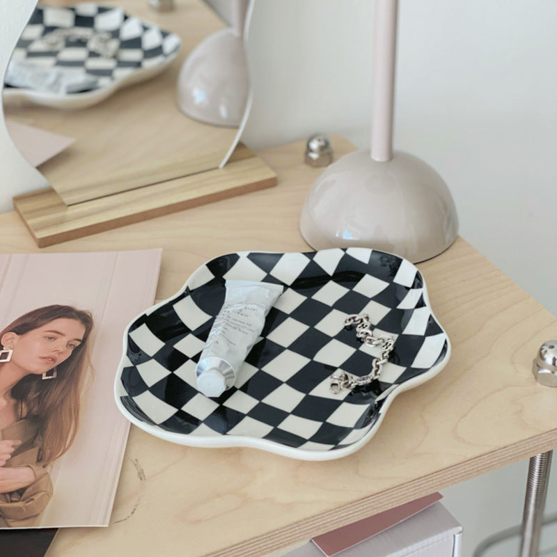 Aesthetic checkerboard display tray in black used as a small accessory tray featuring a striking hand-painted porcelain design perfect for organizing jewelry, keys, or small items while adding modern simplicity to your space.