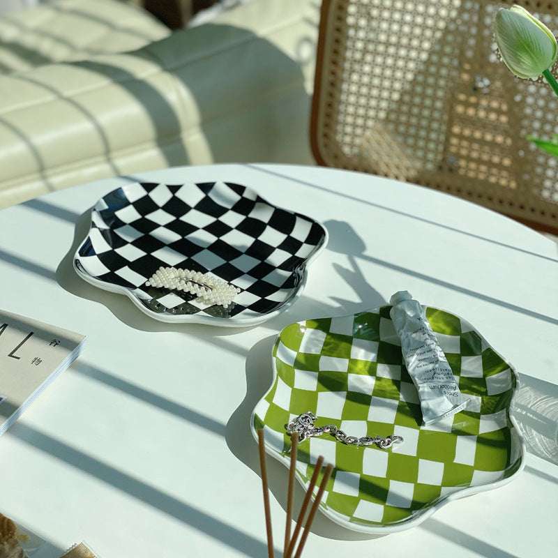 Aesthetic checkerboard display tray in black and green on a table featuring a striking hand-painted porcelain design perfect for adding modern simplicity to your space versatile for serving or display.