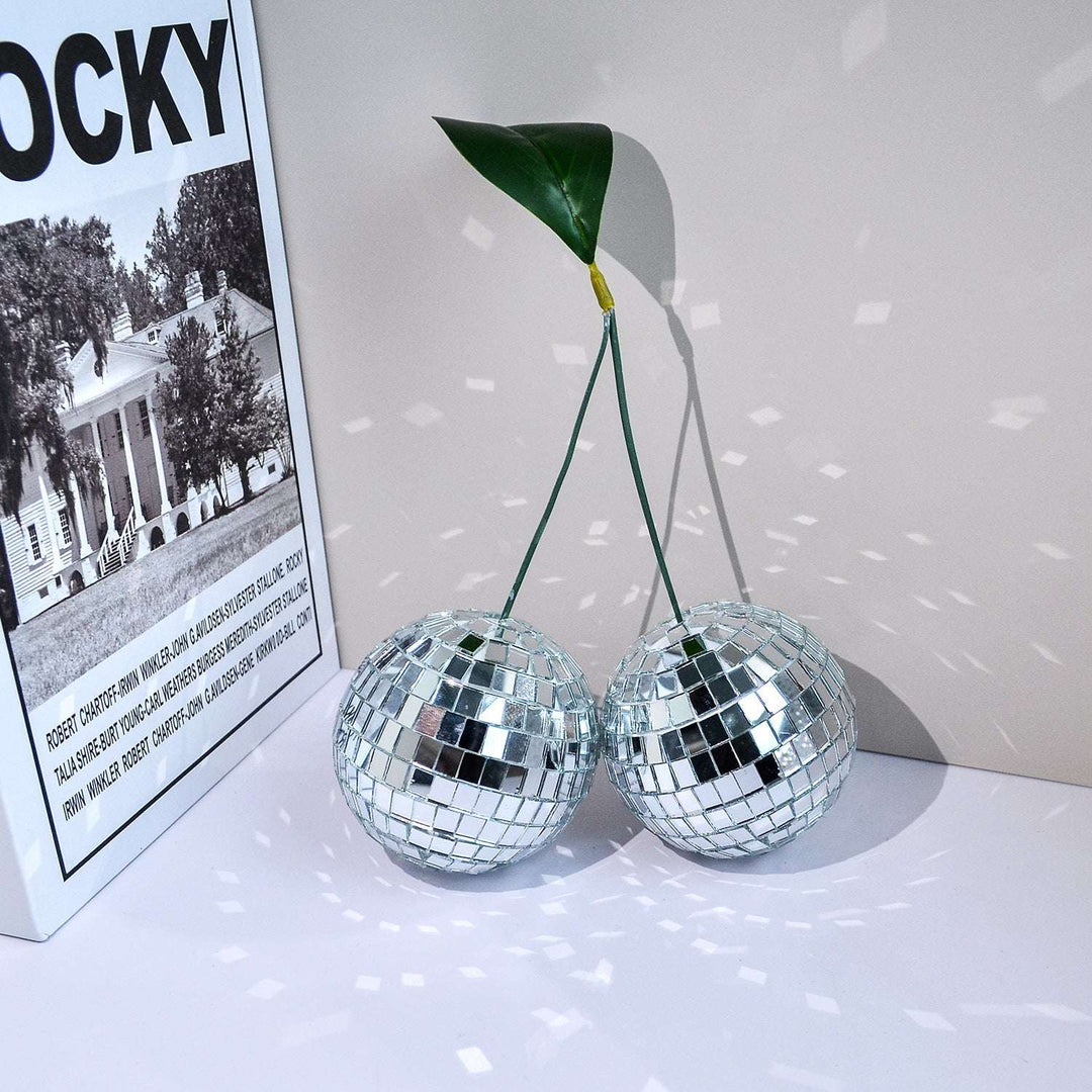 VibeCore Cherry Disco Ball Silver, featuring a stunning geometric design with a shimmering silver mosaic finish, adding a touch of playful elegance and vibrant charm to any space.