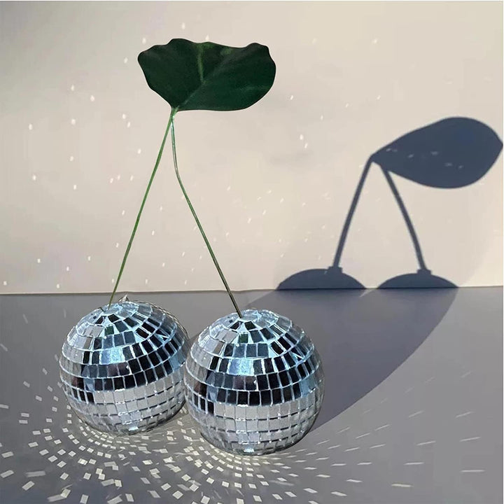 VibeCore Cherry Disco Ball Silver close-up, highlighting its intricate silver mosaic design and shimmering surface, creating a dazzling focal point with modern, playful elegance.