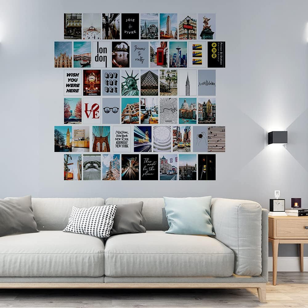 VibeCore City Girl Wall Collage Kit above couch featuring 50 trendy city prints capturing iconic landmarks and chic cityscapes. Perfect for boho decor, urban-inspired, wanderlust, travel vibes, modern living room styling, and stylish city wall art.