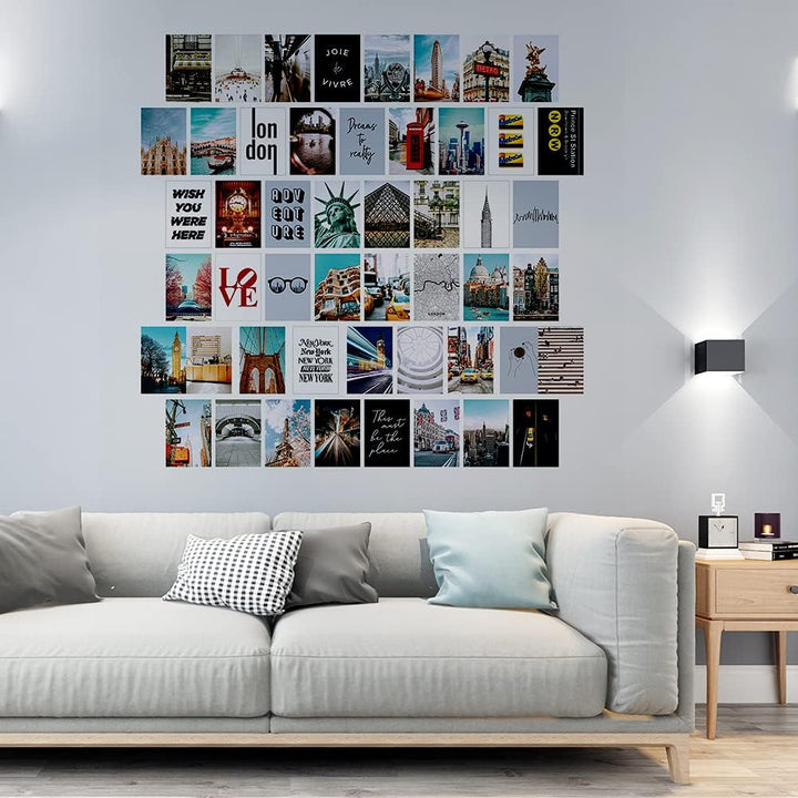 VibeCore City Girl Wall Collage Kit above couch featuring 50 trendy city prints capturing iconic landmarks and chic cityscapes. Perfect for boho decor, urban-inspired, wanderlust, travel vibes, modern living room styling, and stylish city wall art.