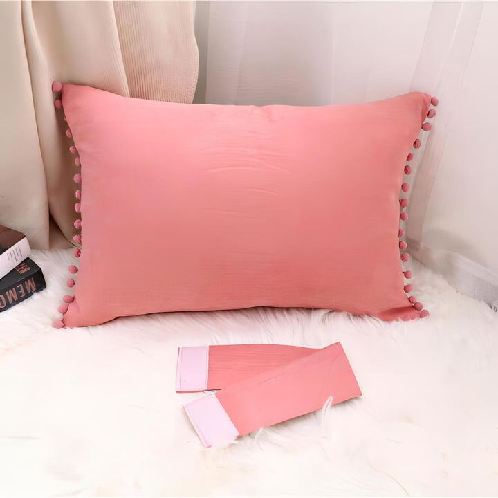 VibeCore Classic Bow Throw Pillow in coral pink without strap, showcasing a simple and chic design with pom-poms around the edges, perfect for adding a playful accent to any room.