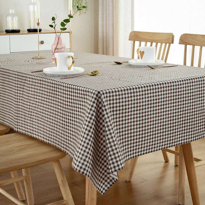 VibeCore Classic Picnic Plaid Tablecloth brown corner view, featuring a vibrant plaid pattern, waterproof, fade-resistant fabric, ideal for stylish gatherings and outdoor events.