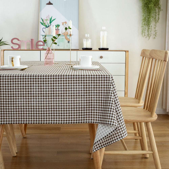 VibeCore Classic Picnic Plaid Tablecloth brown side view, showcasing a vibrant plaid design, waterproof, fade-resistant fabric, and perfect for stylish gatherings.