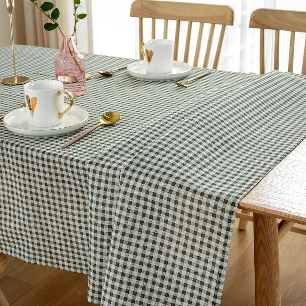 VibeCore Classic Picnic Plaid Tablecloth dark green on table, showcasing a vibrant plaid design with waterproof, fade-resistant fabric, perfect for stylish table settings at any gathering.