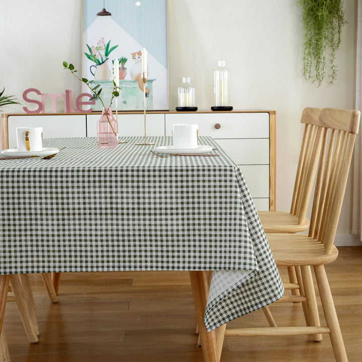 VibeCore Classic Picnic Plaid Tablecloth dark green side view, showcasing a vibrant plaid design, waterproof, fade-resistant fabric, and perfect for stylish gatherings.