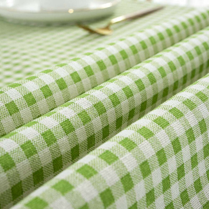 VibeCore Classic Picnic Plaid Tablecloth green close up, highlighting the vibrant plaid pattern and smooth, fade-resistant fabric, perfect for adding charm to any table setting.