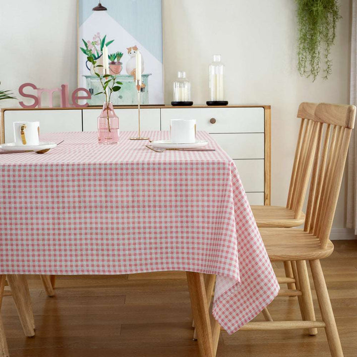 VibeCore Classic Picnic Plaid Tablecloth light pink side view, showcasing a vibrant plaid design, waterproof, fade-resistant fabric, and perfect for stylish gatherings.