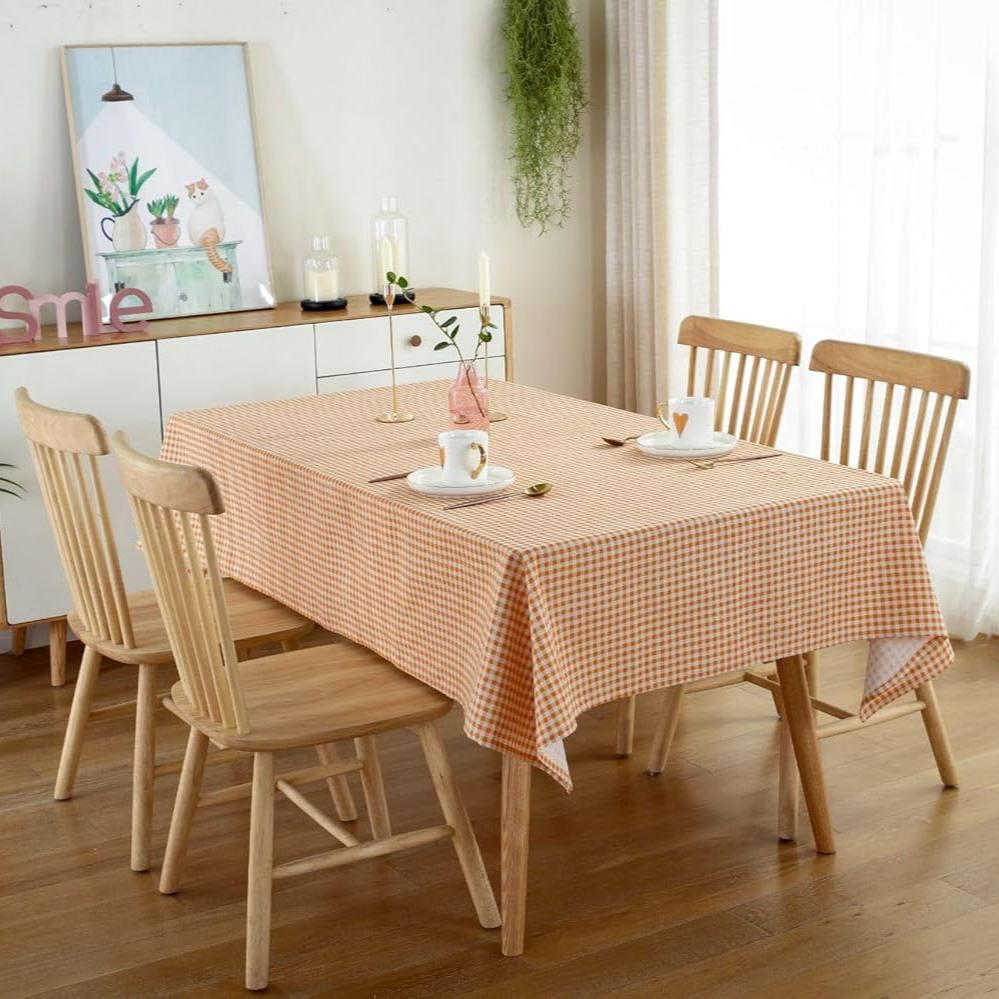 VibeCore Classic Picnic Plaid Tablecloth orange corner view, featuring a vibrant plaid pattern, waterproof, fade-resistant fabric, ideal for stylish gatherings and outdoor events.