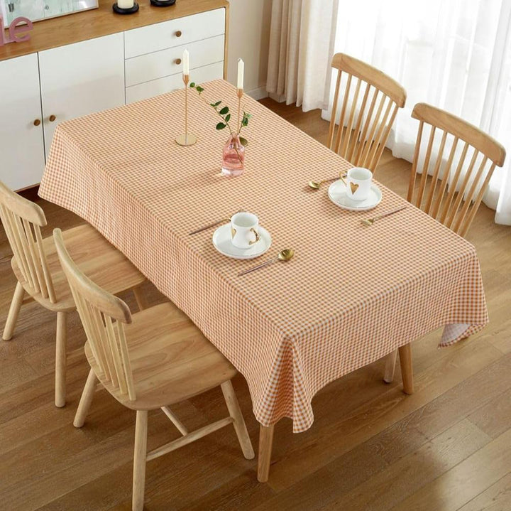 VibeCore Classic Picnic Plaid Tablecloth orange top view, displaying a vibrant plaid pattern, waterproof, fade-resistant fabric, perfect for adding style to any gathering or event.