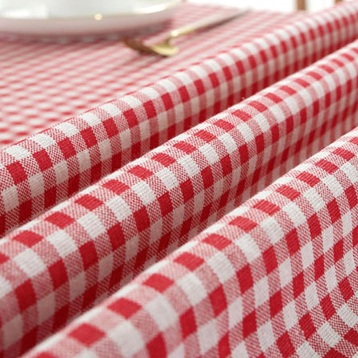 VibeCore Classic Picnic Plaid Tablecloth red close up, highlighting the vibrant plaid pattern and smooth, fade-resistant fabric, perfect for adding charm to any table setting.