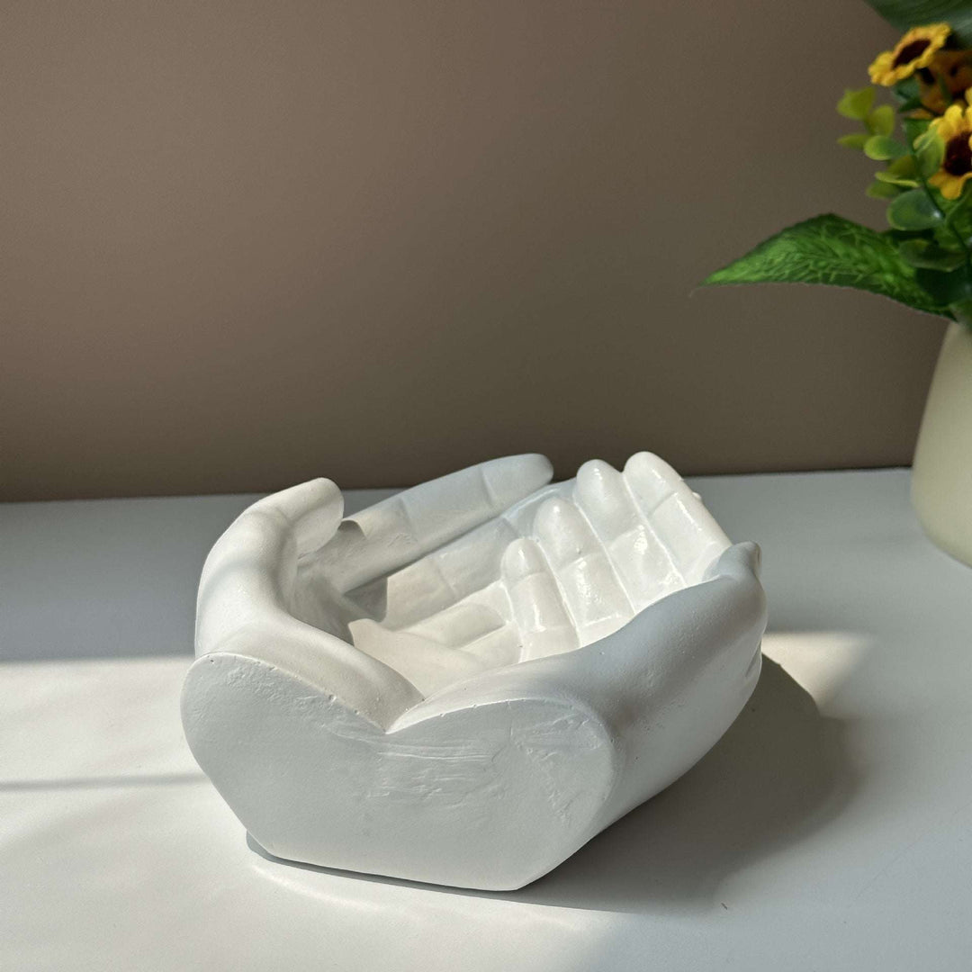 The back view of the VibeCore Closed Hands Display Tray, highlighting its sturdy poly resin construction and smooth, scratch-free bottom.
