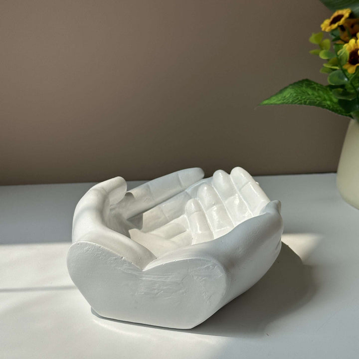The back view of the VibeCore Closed Hands Display Tray, highlighting its sturdy poly resin construction and smooth, scratch-free bottom.