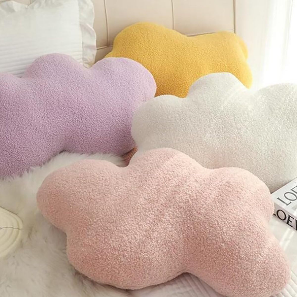 VibeCore Cloud Throw Pillows in white, pink, yellow, and purple, arranged on a bed, showcasing their fluffy, cloud-shaped design. Crafted from soft PP cotton, these cozy pillows bring a serene, calming vibe to your space, enhancing your decor with ultimate comfort and a dreamy feel.
