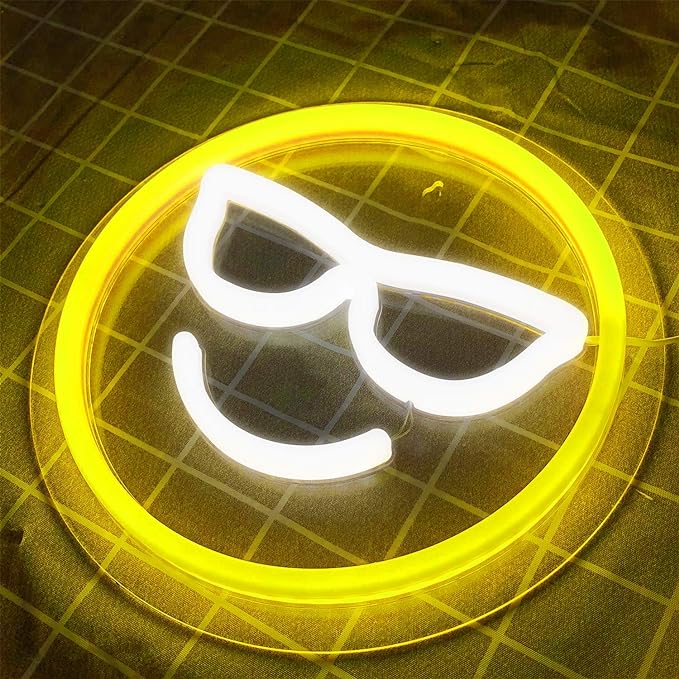 Aesthetic VibeCore Cool Emoji Neon Light on a table, USB-powered LED sign for trendy bedroom, dorm, or gaming room decor, adding a playful, vibrant glow to any space.