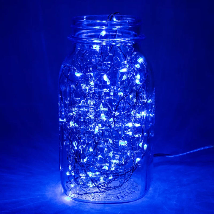 VibeCore copper fairy lights in blue, placed inside a jar, creating a serene and cozy ambiance with a soft, calming glow.