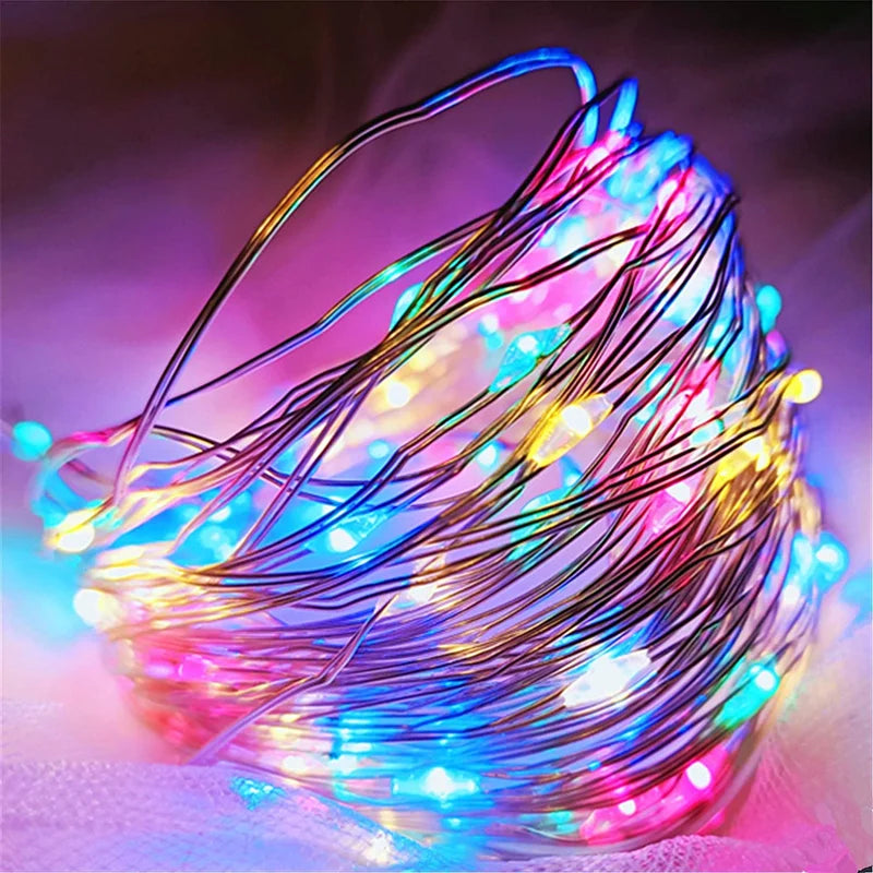 Close-up of VibeCore copper fairy lights in multicolor, glowing vibrantly and adding a dynamic, cozy atmosphere to any space.