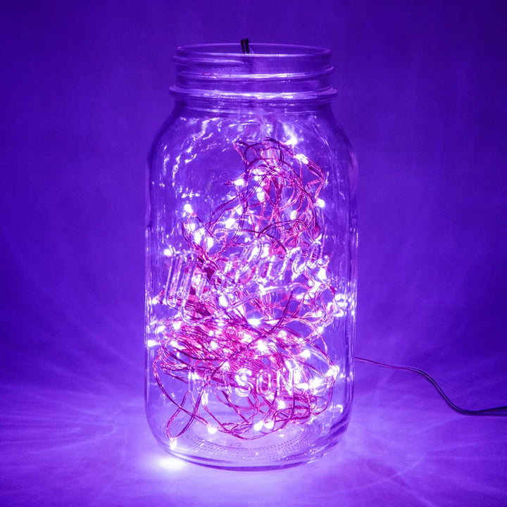 VibeCore copper fairy lights in purple, placed inside a jar, creating a magical and cozy atmosphere with a soft, enchanting glow.