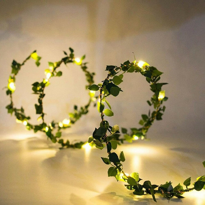 VibeCore copper leaf garland string lights, featuring 100 warm white LEDs on a lush, artificial vine, creating a cozy and vibrant glow for any space.