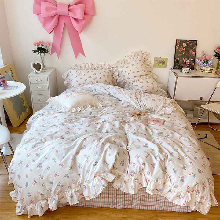 Aerial view of the 'Blossom French Ruffles Bedding Set,' showcasing delicate French ruffles and dainty floral details on luxuriously soft fabric. This elegant and cozy bedding set creates a romantic and coquette vibe, perfect for enhancing any bedroom or dorm aesthetic.