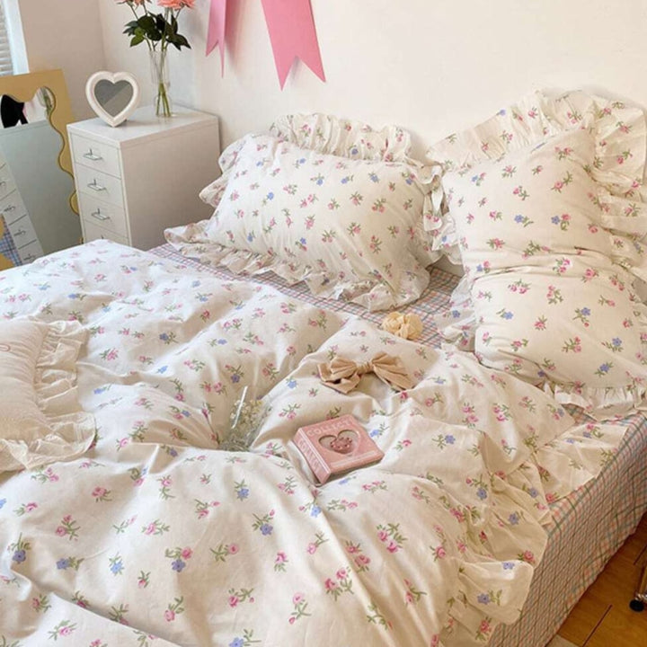 Side view of the 'Blossom French Ruffles Bedding Set,' showcasing the luxurious soft fabric, delicate French ruffles, and elegant floral design. This bedding set offers a sophisticated and coquette look, perfect for creating a chic and cozy bedroom or dorm atmosphere.