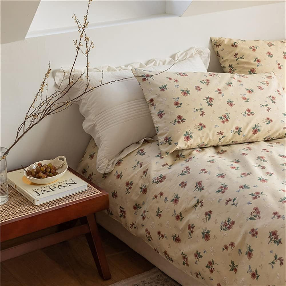 Close-up view of the VibeCore Cottagecore Vintage Floral Duvet Cover Set, showcasing intricate vintage floral patterns on soft, high-quality fabric, perfect for adding an aesthetic, cozy touch to your bedroom or dorm decor.