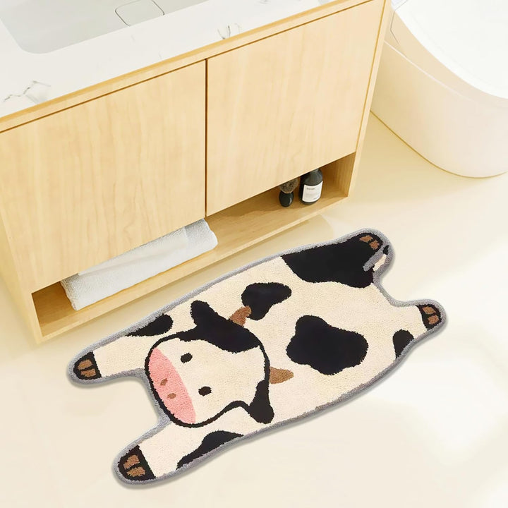 VibeCore Cow Accent Rug placed in a bathroom, showcasing its cozy design and soft texture, adding a playful touch to the space with its relaxed cow graphic.