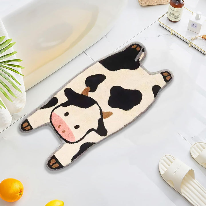 VibeCore Cow Accent Rug in front of a bathtub, showcasing the soft, fluffy texture and playful cow design, perfect for adding charm and comfort to any room.