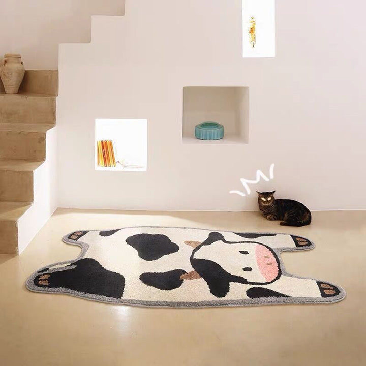 VibeCore Cow Accent Rug on the floor by stairs, showcasing its plush texture and playful cow design, enhancing the cozy atmosphere of the space.