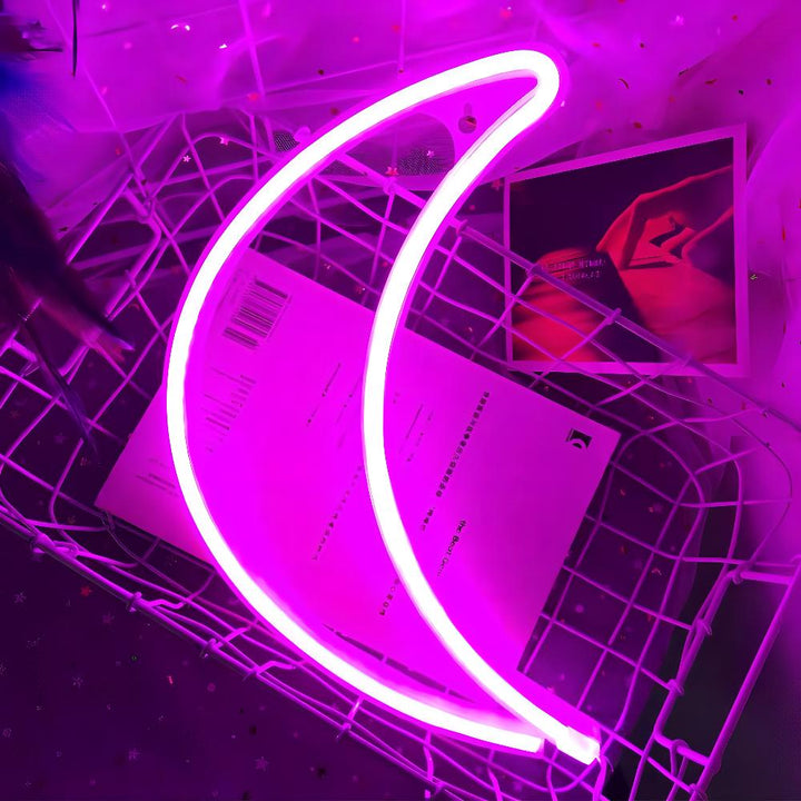 VibeCore Crescent Moon Neon Light Pink, glowing softly with a vibrant pink hue, creating a dreamy and calming atmosphere.