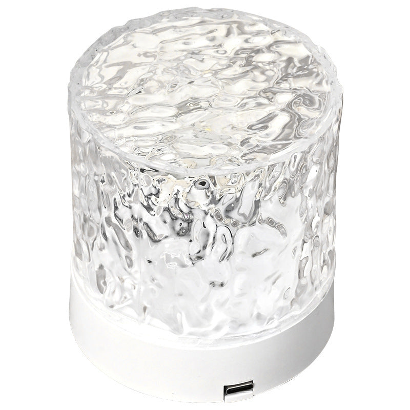 VibeCore Crystal Light Projector product view, showcasing its sleek design and 16 vibrant color options. Featuring touch control, USB rechargeability, and a portable design, this projector is perfect for adding customizable mood lighting, cozy ambiance, and aesthetic decor to any space.