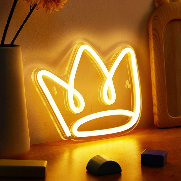 Aesthetic angled view of the VibeCore Cursive Crown Neon Light, USB-powered LED sign for trendy bedroom, dorm, or lounge decor, highlighting its chic, glowing design and royal flair.