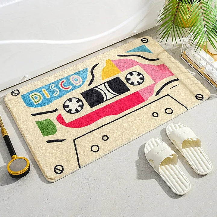 VibeCore Cute Cassette Accent Rug in beige, featuring a vintage cassette tape design with a soft, plush texture and non-slip backing, ideal for a retro aesthetic in any room.